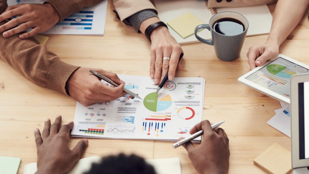 Team reviewing business analytics reports together